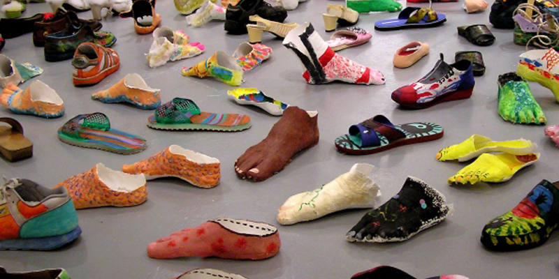 My Le Thi, Walk the Earth 1995-2005, Installation view with shoes, plaster-cast feet, video, Dimensions variable